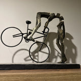 Libra Interiors Playful Kissing Couple on a Bike Sculpture - Metallic Bronze
