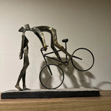Libra Interiors Playful Kissing Couple on a Bike Sculpture - Metallic Bronze